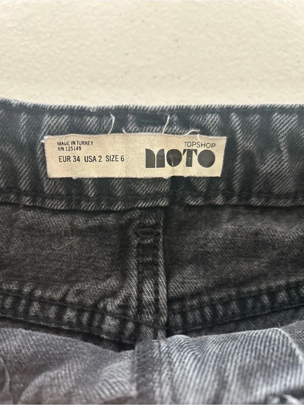 Topshop Moto Black Denim Mini Skirt Raw Hem High Rise  size 2 Women’s
